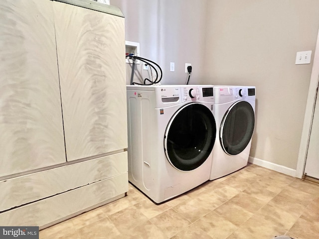 laundry room featuring washer and clothes dryer