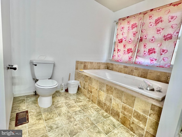 bathroom with a relaxing tiled tub and toilet