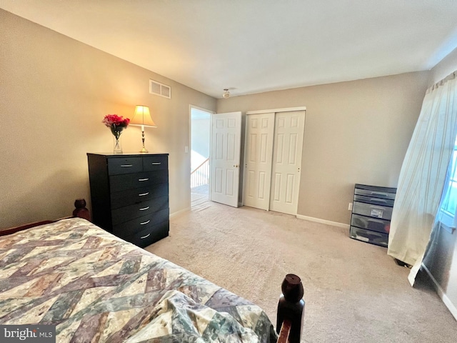 carpeted bedroom featuring a closet