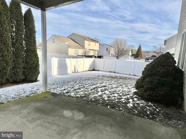 view of yard covered in snow