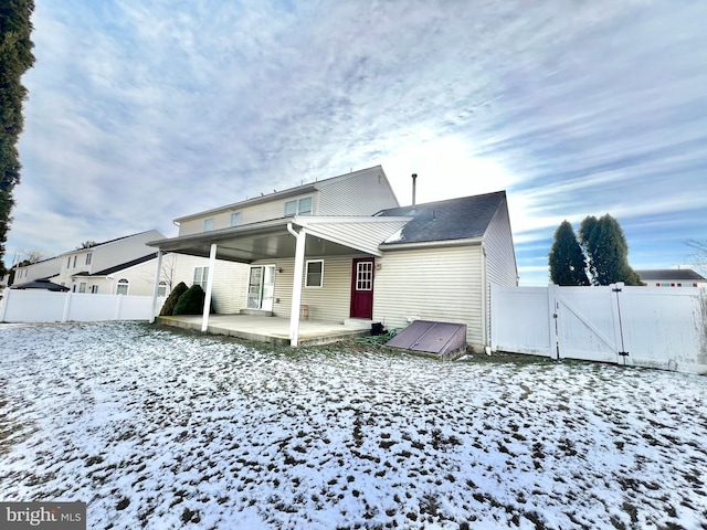 view of snow covered property