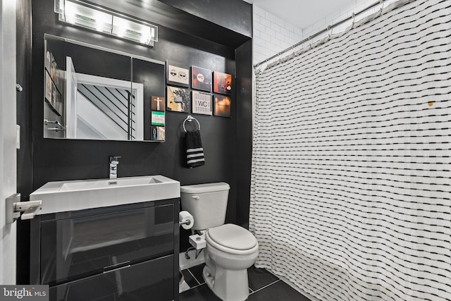 bathroom with a shower with curtain, vanity, toilet, and tile patterned flooring