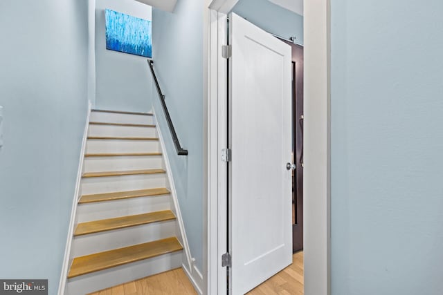 stairs with wood-type flooring