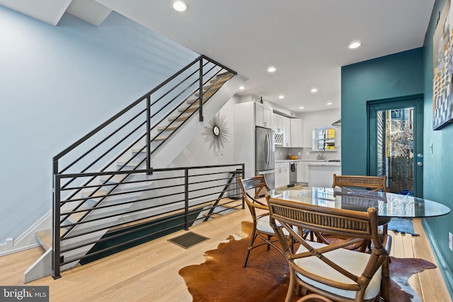 dining area with light hardwood / wood-style floors