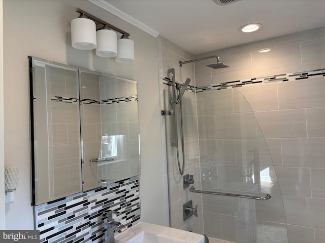 bathroom featuring decorative backsplash, ornamental molding, and walk in shower