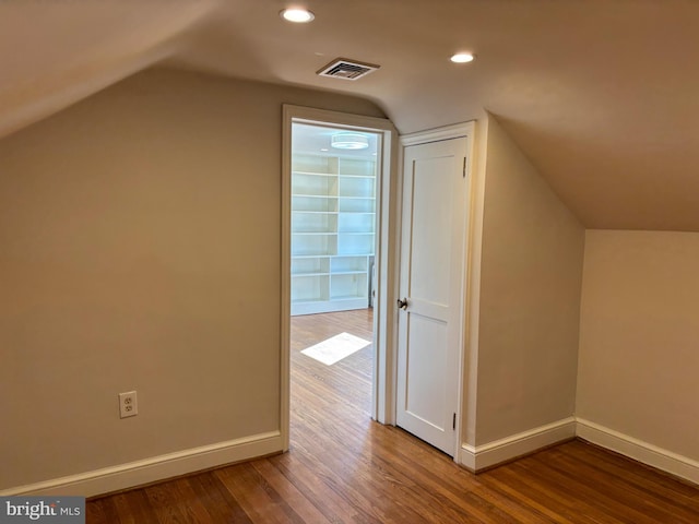 bonus room featuring hardwood / wood-style floors and lofted ceiling