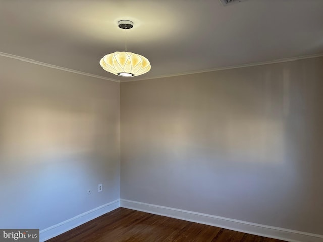 spare room featuring dark hardwood / wood-style floors