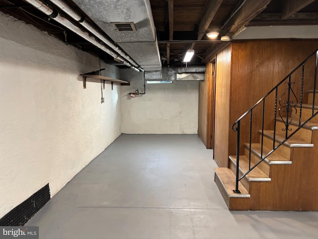 basement with wood walls