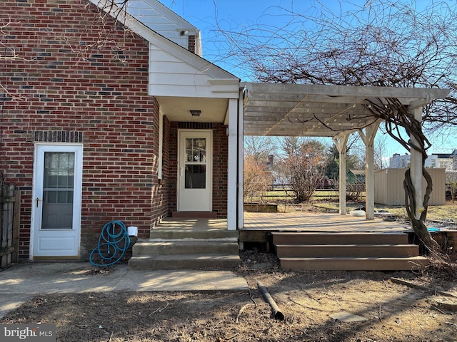 property entrance featuring a pergola