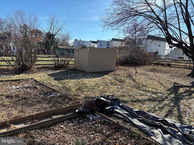 view of yard with a storage shed