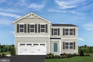 view of front facade featuring a front yard and a garage