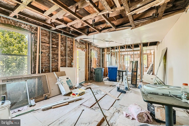 miscellaneous room featuring brick wall