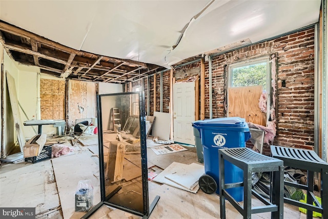 miscellaneous room with brick wall