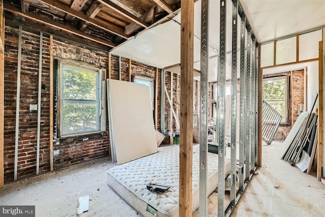 miscellaneous room with brick wall