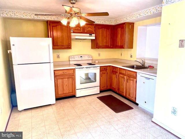 kitchen with white appliances, ceiling fan, and sink