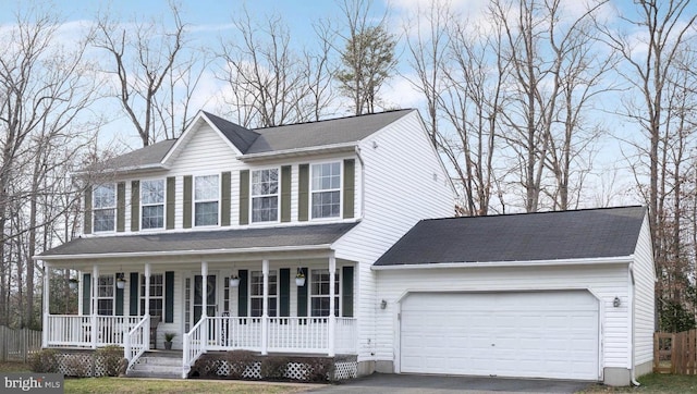 view of front facade featuring a porch and a garage