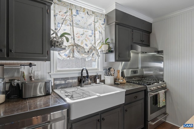 kitchen featuring ventilation hood, sink, gray cabinets, ornamental molding, and gas stove