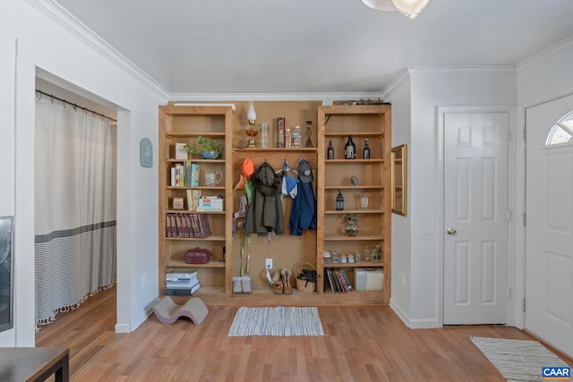 interior space featuring hardwood / wood-style flooring and ornamental molding