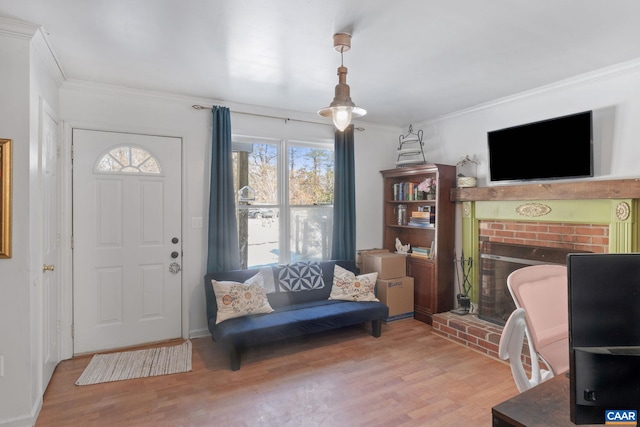 foyer entrance with wood-type flooring and crown molding