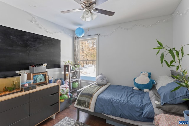 bedroom with ceiling fan and dark wood-type flooring