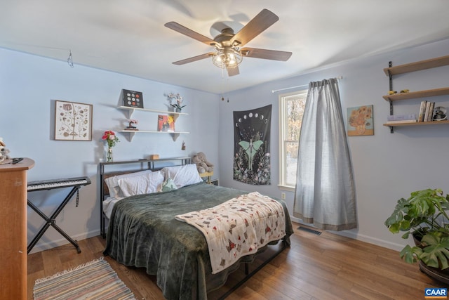 bedroom featuring hardwood / wood-style floors and ceiling fan