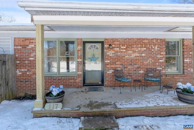 view of snow covered property entrance