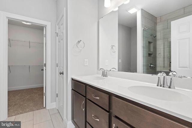 bathroom featuring vanity and an enclosed shower