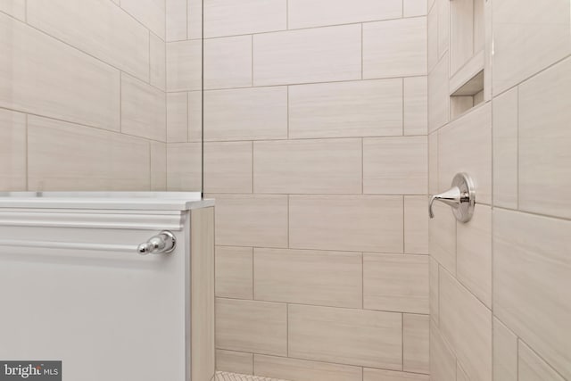 bathroom with tiled shower