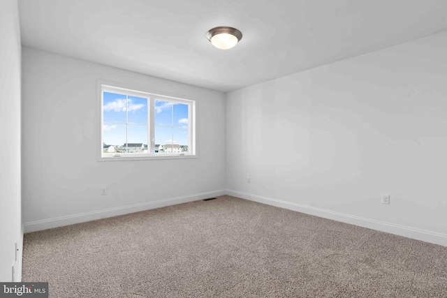 view of carpeted spare room