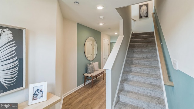 staircase featuring hardwood / wood-style floors