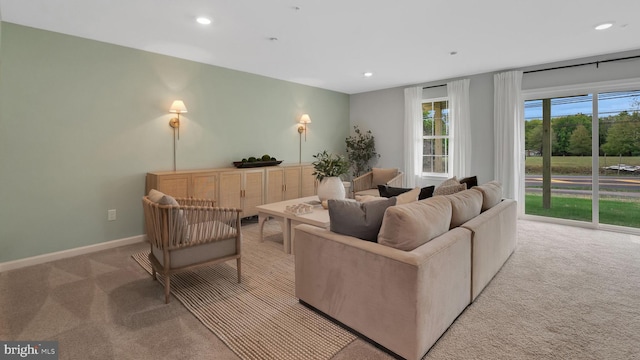 living room featuring light carpet