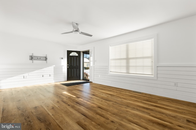 foyer entrance with hardwood / wood-style flooring and ceiling fan