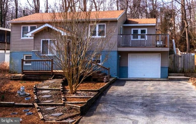 view of front of property with a garage and a balcony