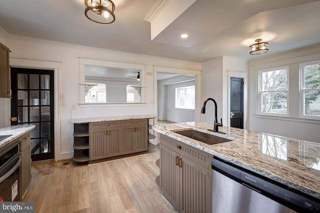 kitchen with light stone countertops, sink, light hardwood / wood-style flooring, crown molding, and appliances with stainless steel finishes