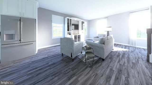 living room featuring dark hardwood / wood-style flooring and a wealth of natural light