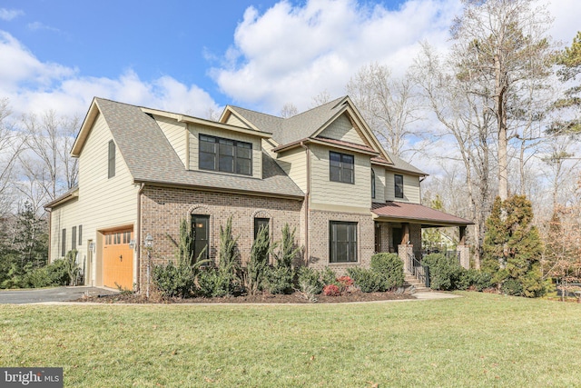 view of front facade featuring a front yard, a garage, and a porch