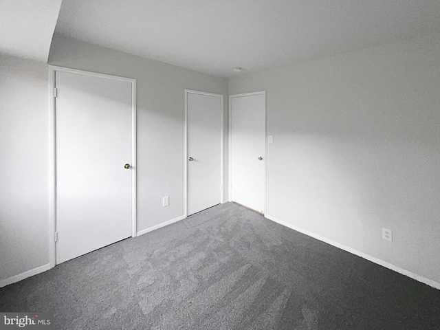 unfurnished bedroom with carpet