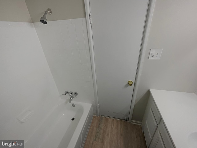 bathroom featuring shower / tub combination, vanity, and wood-type flooring