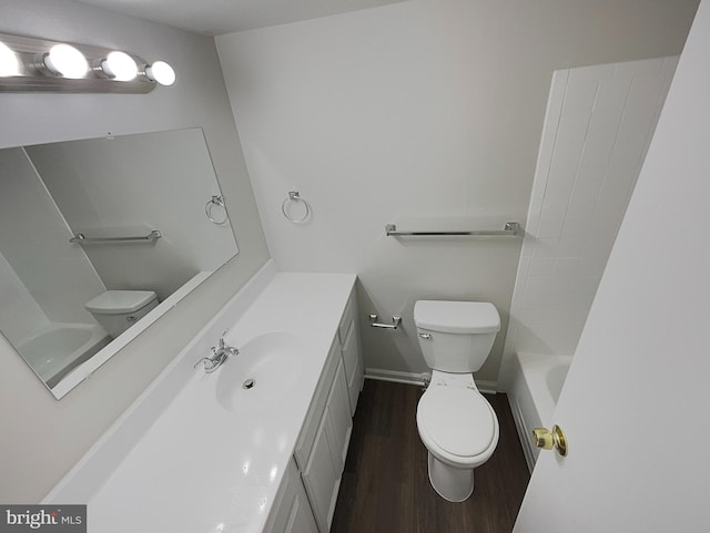 full bathroom with vanity, toilet, wood-type flooring, and shower / tub combination