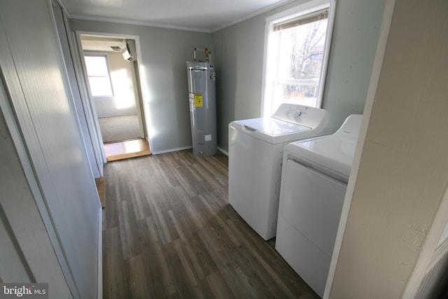 laundry area with washer and dryer, electric water heater, dark hardwood / wood-style floors, and ornamental molding