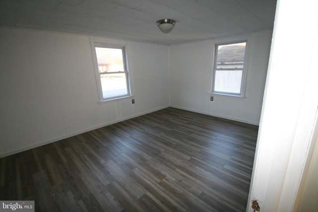 spare room featuring dark hardwood / wood-style floors