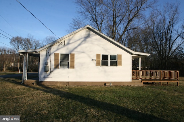 view of property exterior featuring a lawn and a wooden deck