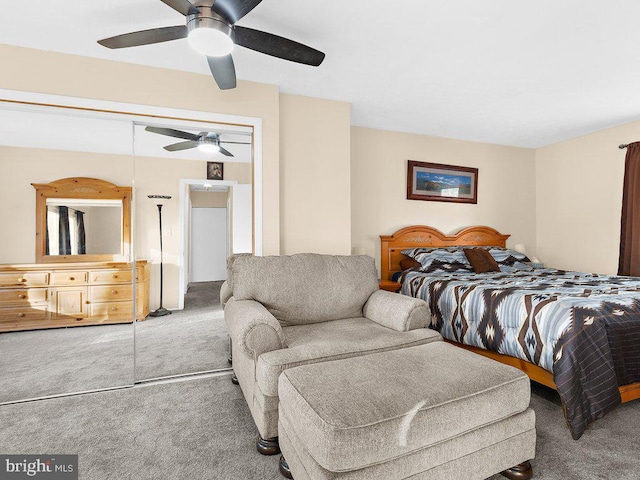 carpeted bedroom with a closet and ceiling fan