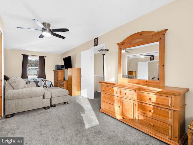 carpeted living room featuring ceiling fan