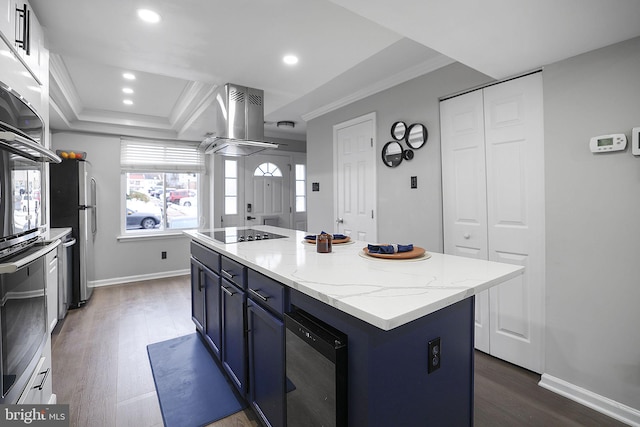 kitchen featuring light stone countertops, a kitchen island, island exhaust hood, stainless steel appliances, and ornamental molding