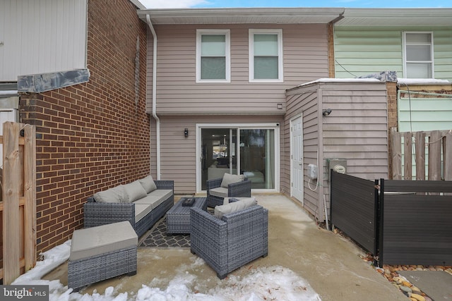 rear view of house featuring outdoor lounge area and a patio