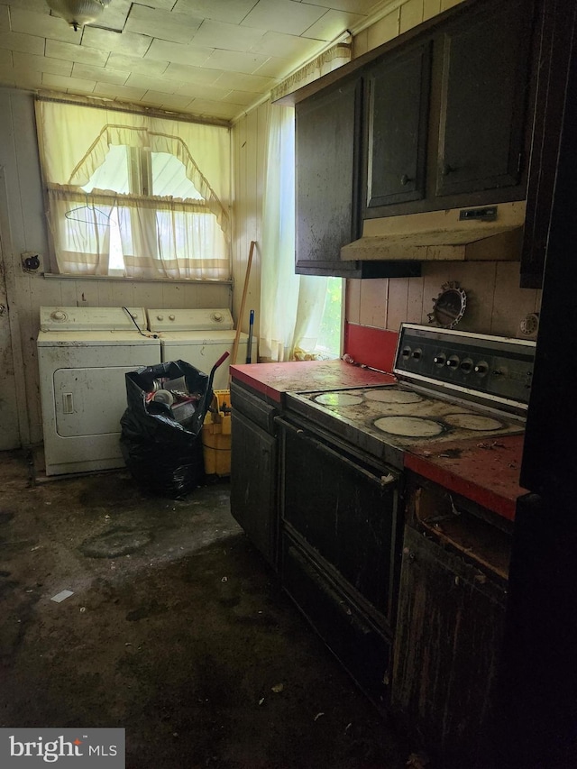 kitchen featuring black electric range oven and washing machine and clothes dryer