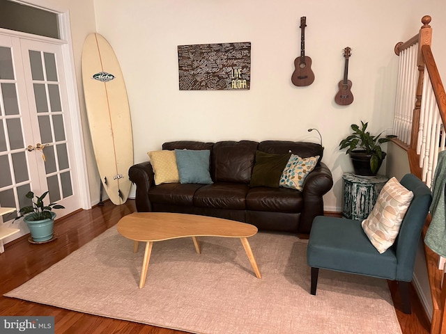 living room featuring french doors and dark hardwood / wood-style flooring