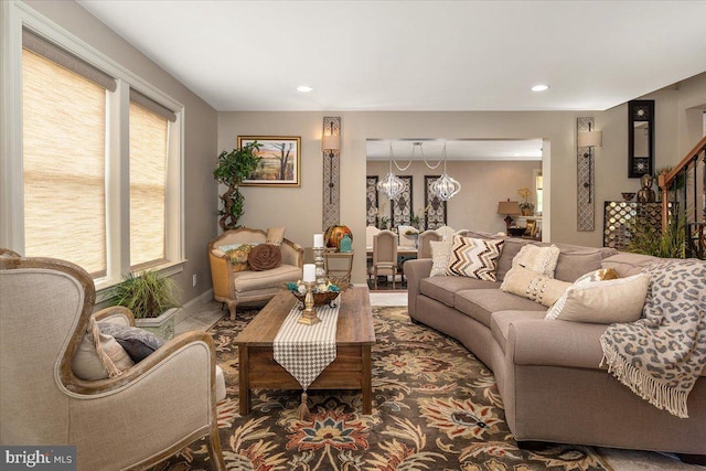 living room featuring an inviting chandelier and a wealth of natural light