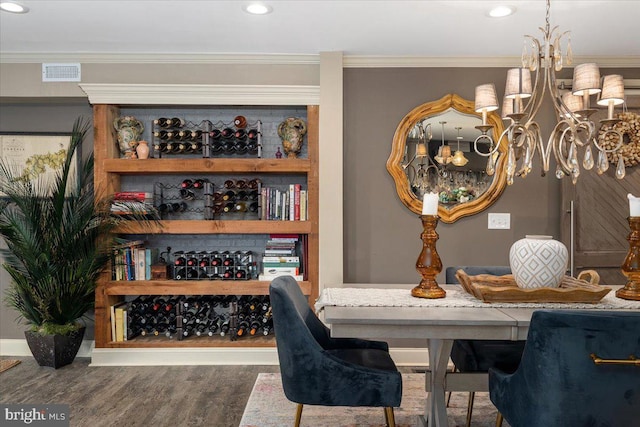 dining area featuring dark hardwood / wood-style floors and crown molding